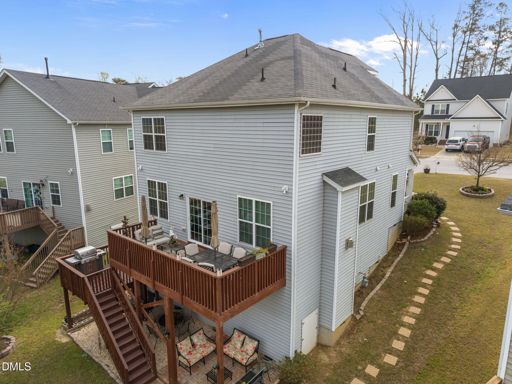 5049 Jelynn Street Raleigh, NC 27616 - Photo 29 of 33 a view of a dinning table and chairs in patio of the house