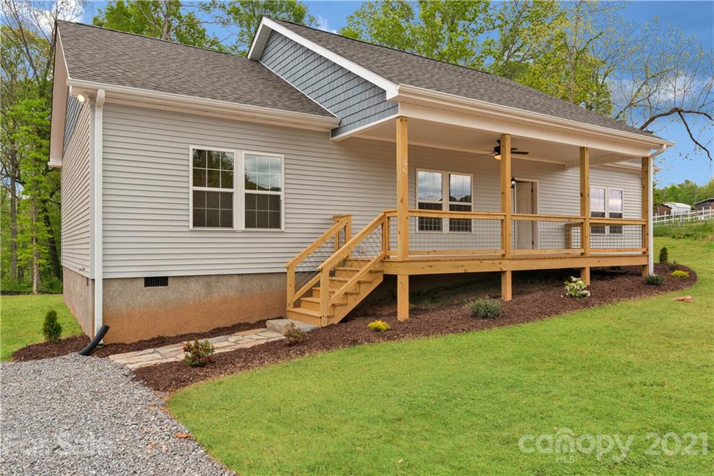 296 Ridge View Drive, Unit 7 Clyde, NC 28721 - Photo 1 of 19 a view of a house with a backyard