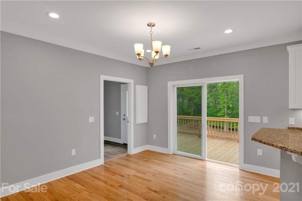 296 Ridge View Drive, Unit 7 Clyde, NC 28721 - Photo 12 of 19 a view of an empty room with a window
