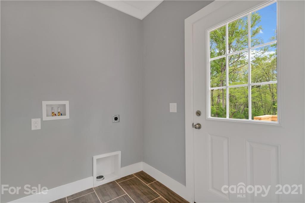 296 Ridge View Drive, Unit 7 Clyde, NC 28721 - Photo 14 of 19 a view of an empty room and window