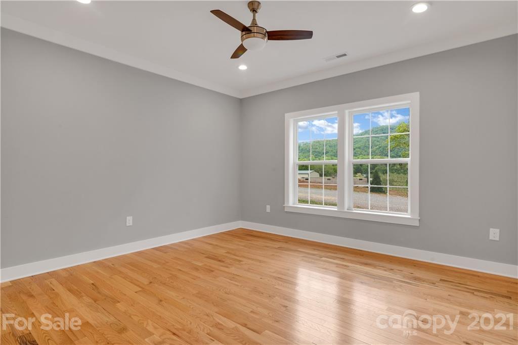 296 Ridge View Drive, Unit 7 Clyde, NC 28721 - Photo 16 of 19 a view of an empty room with a window