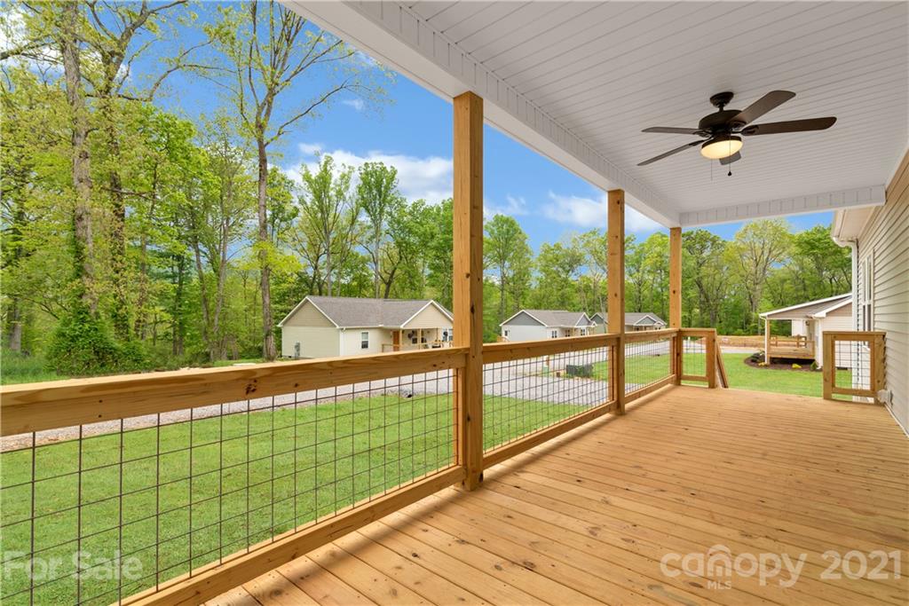 296 Ridge View Drive, Unit 7 Clyde, NC 28721 - Photo 4 of 19 a view of a balcony with yard