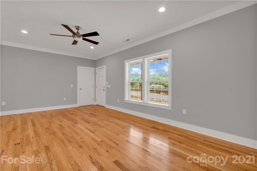 296 Ridge View Drive, Unit 7 Clyde, NC 28721 - Photo 6 of 19 a view of an empty room with a window