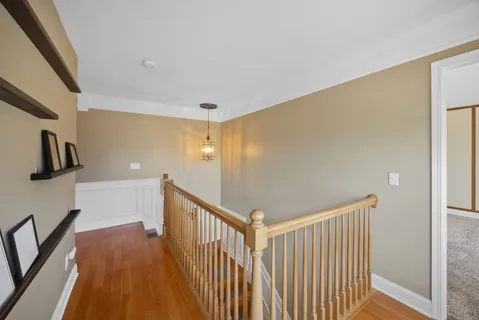 a view of a hallway with stairs