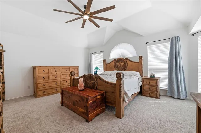 a bed room with a bed and a chandelier
