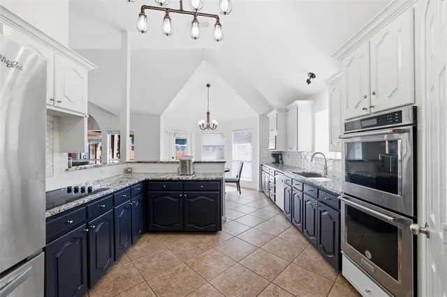 a large kitchen with a stove top oven