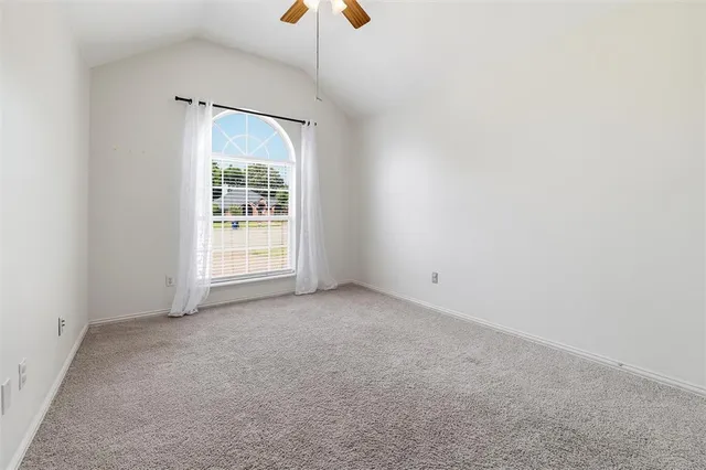 an empty room with windows and entrance