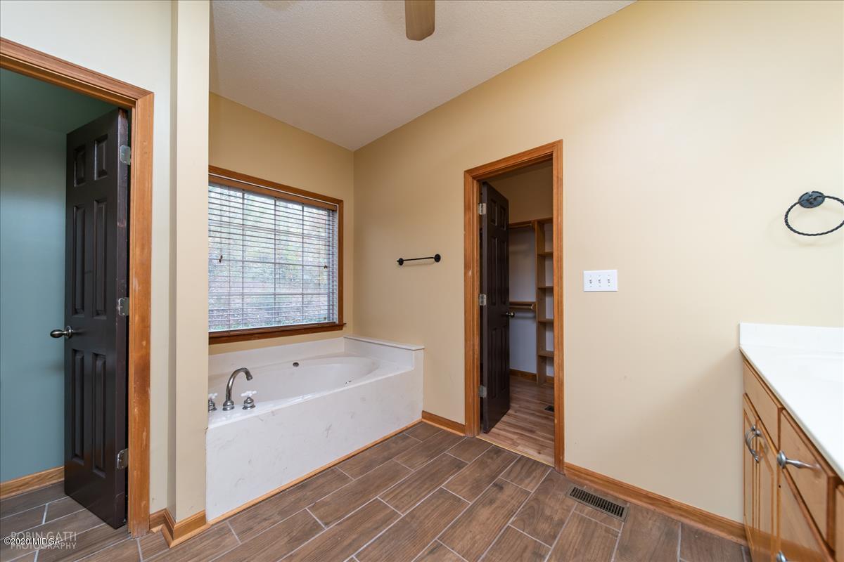 146 Old Graham Road Gray, GA 31032 - Photo 11 of 33 a bathroom with a tub and shower