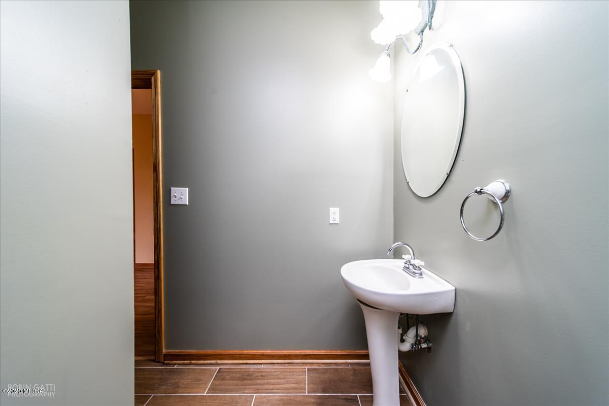 146 Old Graham Road Gray, GA 31032 - Photo 18 of 33 a bathroom with a sink and a mirror
