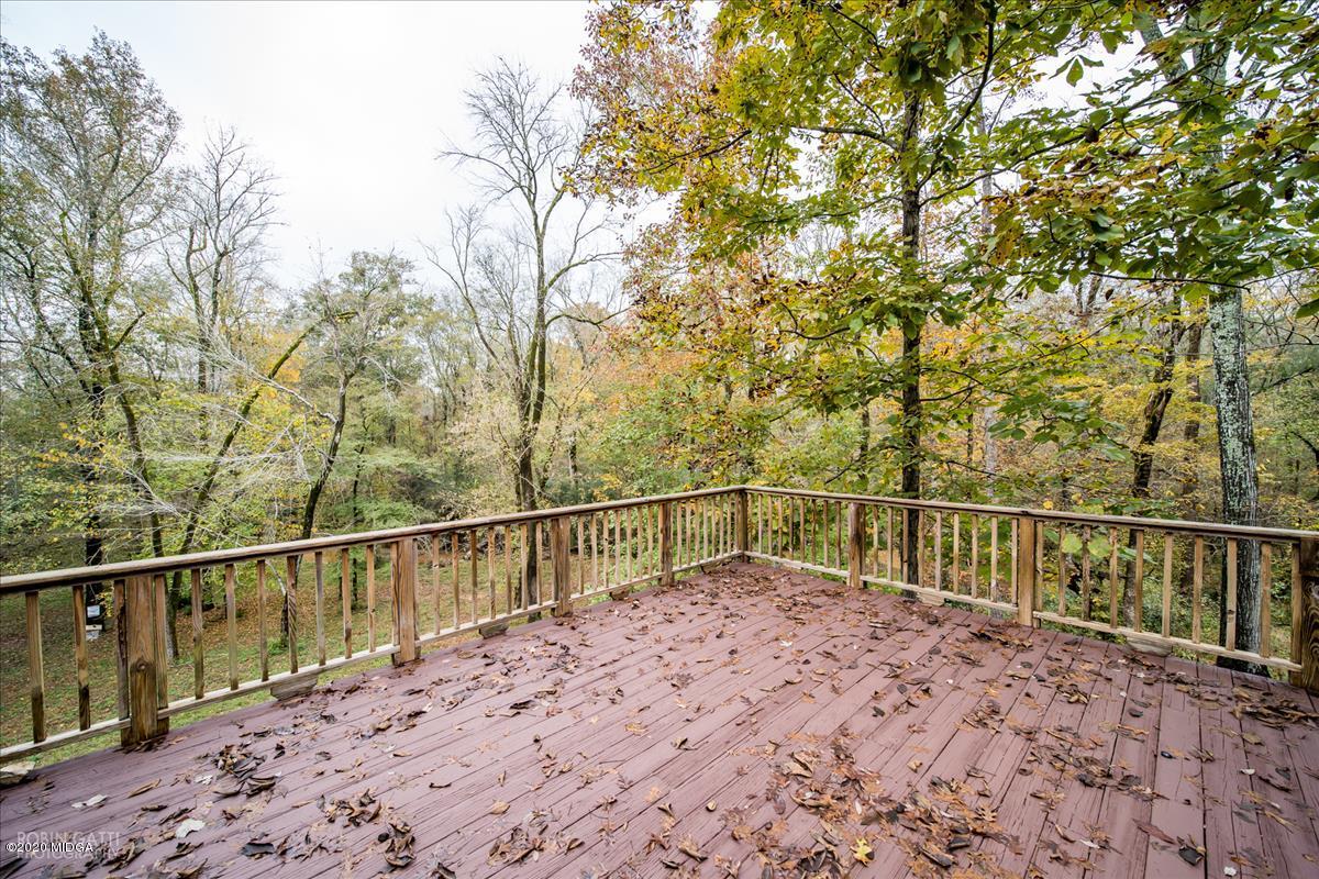 146 Old Graham Road Gray, GA 31032 - Photo 22 of 33 a view of a balcony with wooden floor and fence