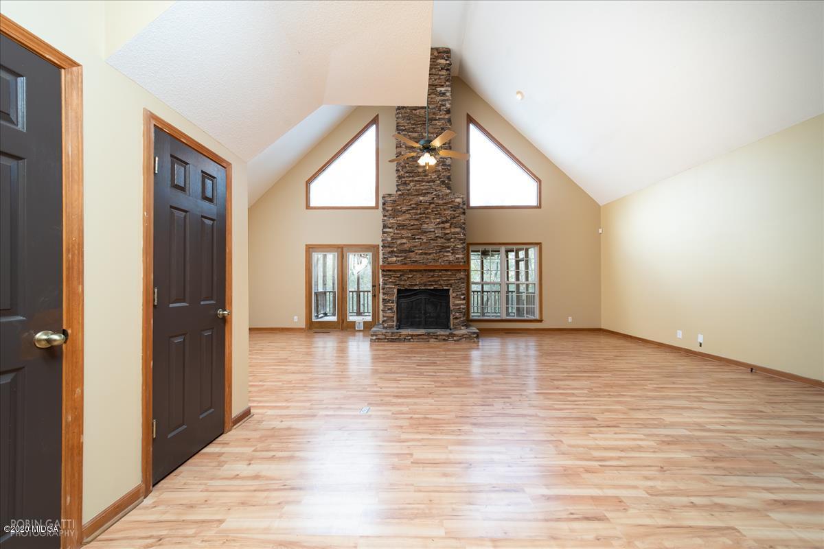 146 Old Graham Road Gray, GA 31032 - Photo 4 of 33 a view of an empty room with wooden floor and a fireplace