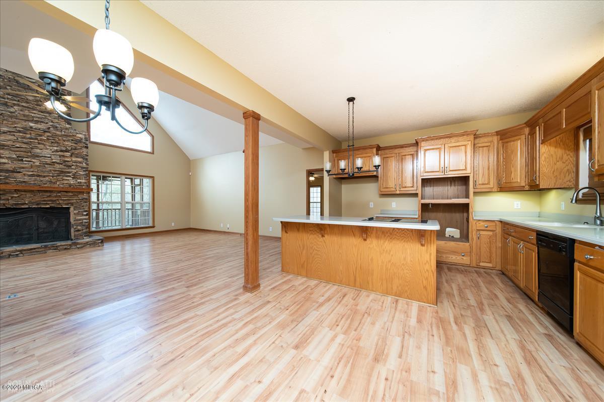 146 Old Graham Road Gray, GA 31032 - Photo 8 of 33 a large kitchen with cabinets wooden floor and stainless steel appliances