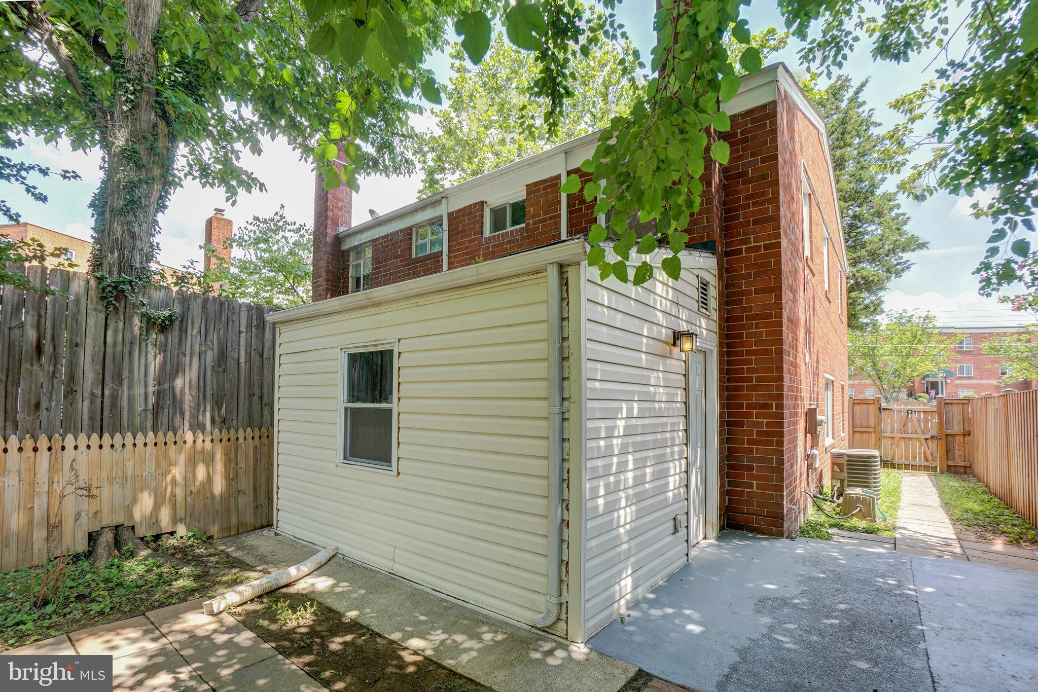 628 Four Mile Road Alexandria, VA 22305 - Photo 27 of 29 a view of a house with a yard