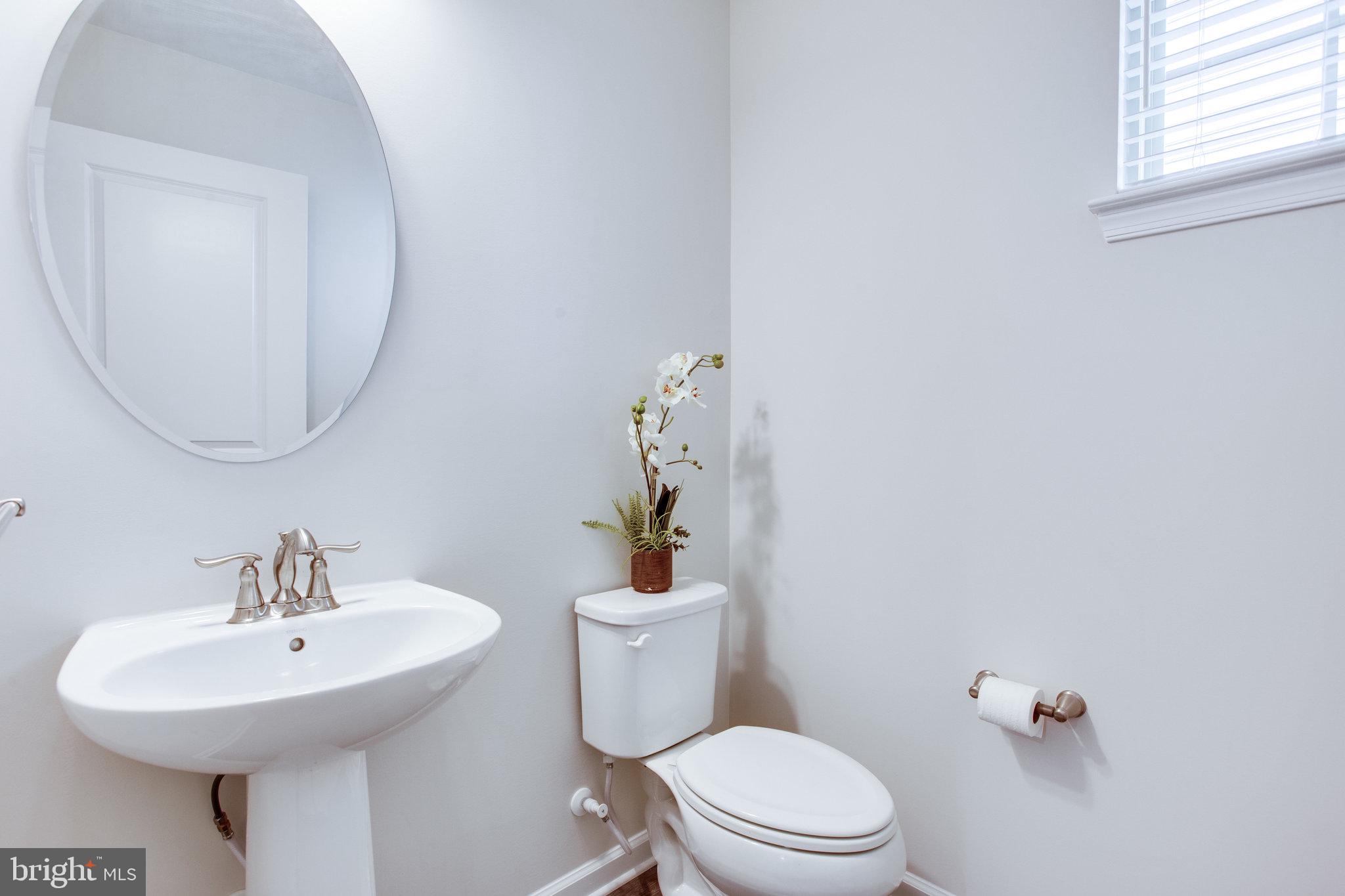 702 Potterfields Court Brunswick, MD 21716 - Photo 36 of 91 half bath on first floor near office and garage