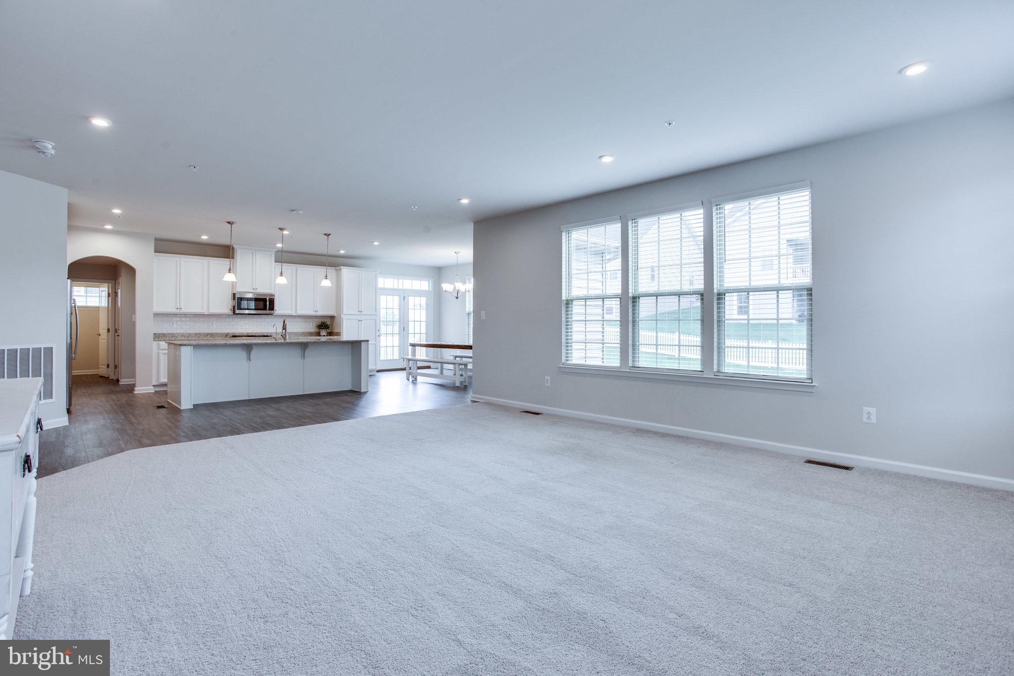 702 Potterfields Court Brunswick, MD 21716 - Photo 39 of 91 open space living room to kitchen