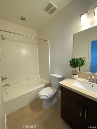 a bathroom with a sink a toilet and bathtub