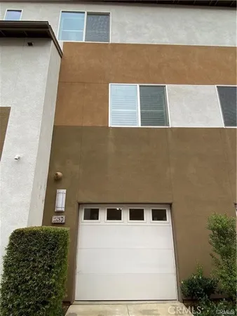 a view of a car garage both side of a house