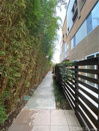 a view of path along with house and trees