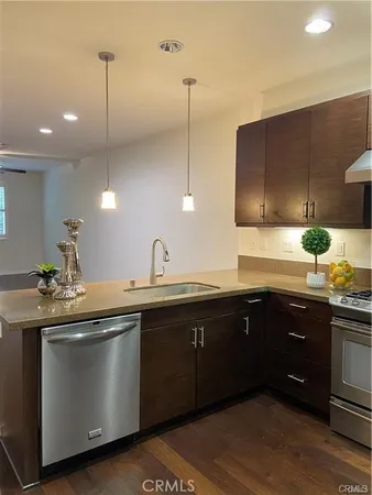 a kitchen with sink and cabinets