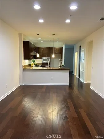a view of a kitchen with a sink and microwave