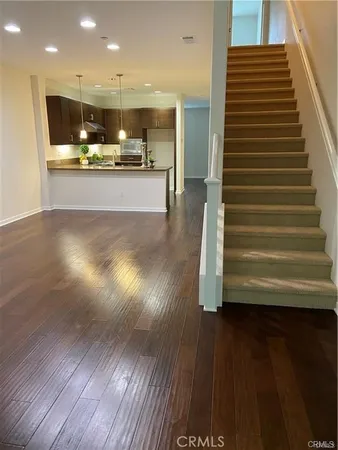 a view of kitchen with cabinets and wooden floor