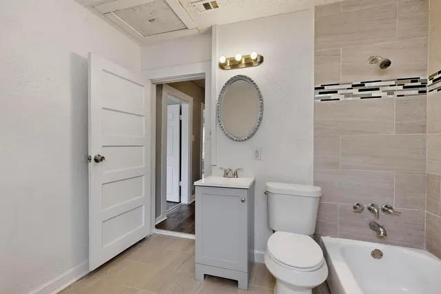 a bathroom with a toilet a sink and a bathtub