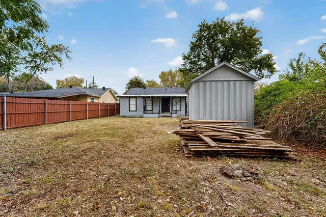 a view of staircase with a rug and a window