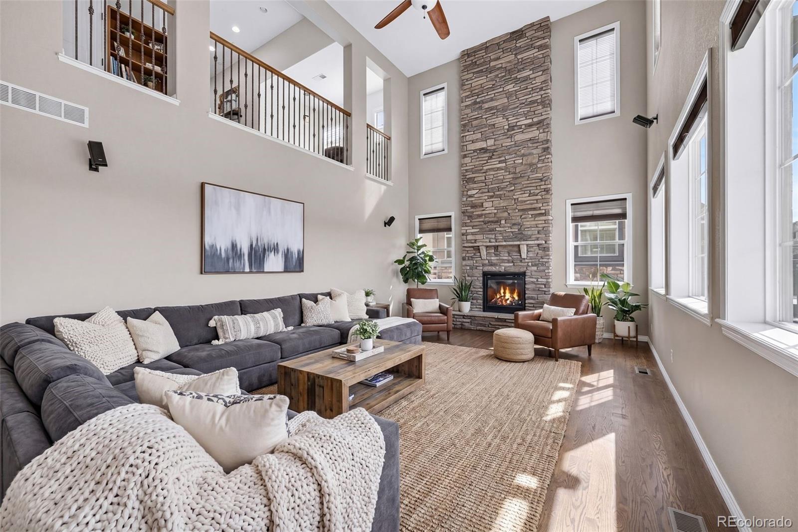 10872 Valleybrook Circle Highlands Ranch, CO 80130 - Photo 19 of 50 a living room with furniture fireplace and a large window