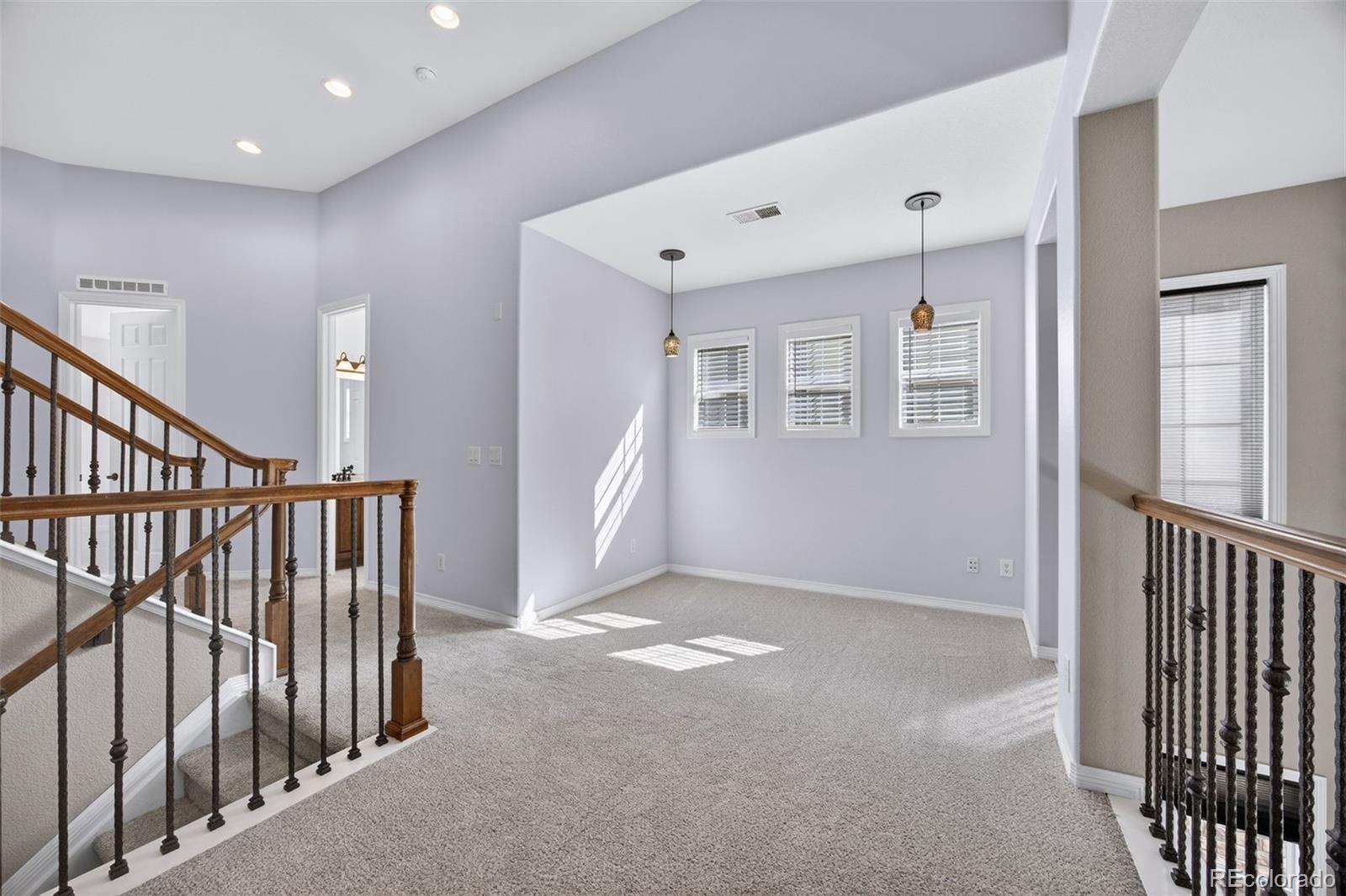 10872 Valleybrook Circle Highlands Ranch, CO 80130 - Photo 23 of 50 a view of livingroom with stairs and windows