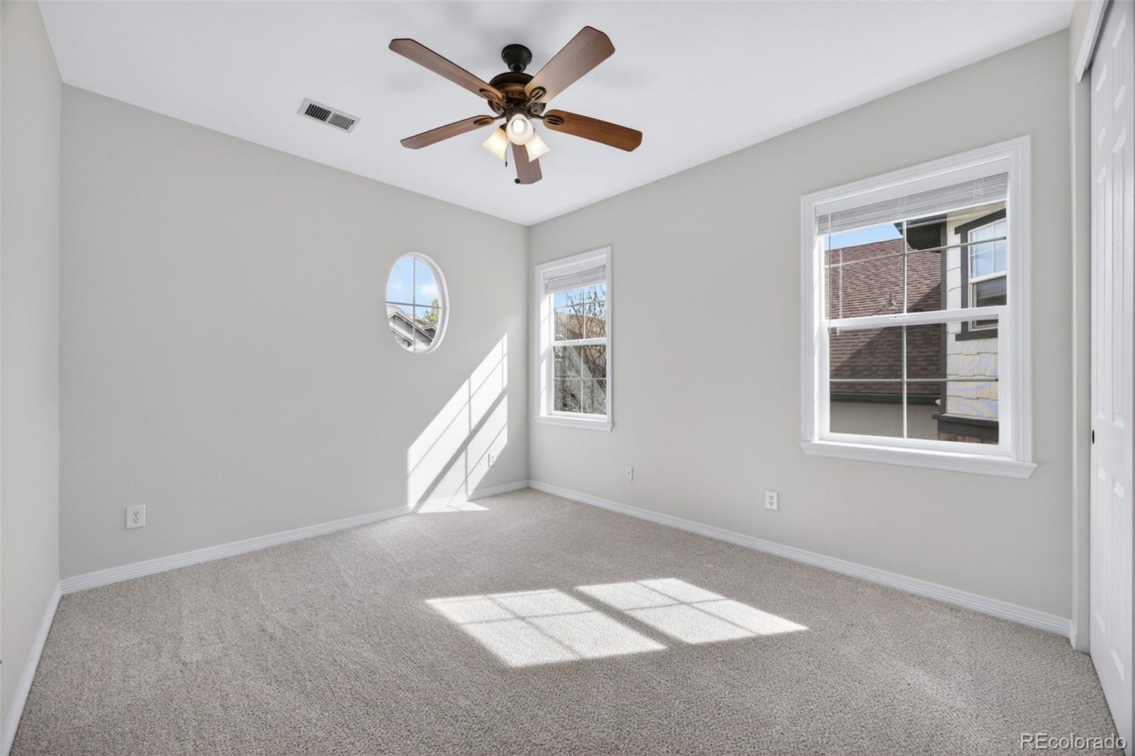 10872 Valleybrook Circle Highlands Ranch, CO 80130 - Photo 26 of 50 a view of an empty room with a window