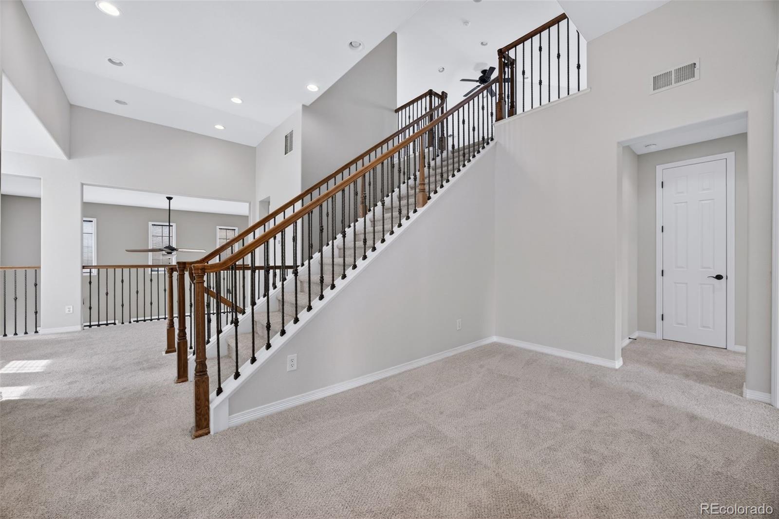 10872 Valleybrook Circle Highlands Ranch, CO 80130 - Photo 28 of 50 a view of staircase with railing and stairs