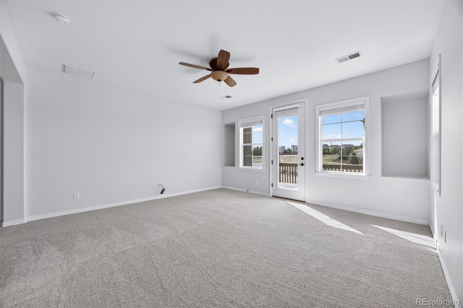 10872 Valleybrook Circle Highlands Ranch, CO 80130 - Photo 33 of 50 a view of an empty room with a window