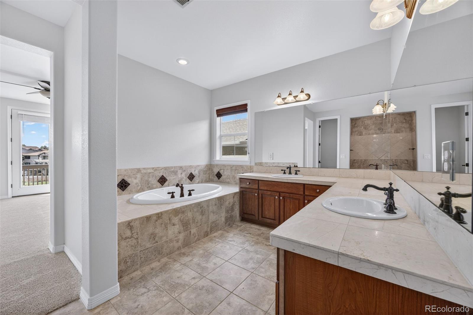 10872 Valleybrook Circle Highlands Ranch, CO 80130 - Photo 38 of 50 a bathroom with a sink double vanity