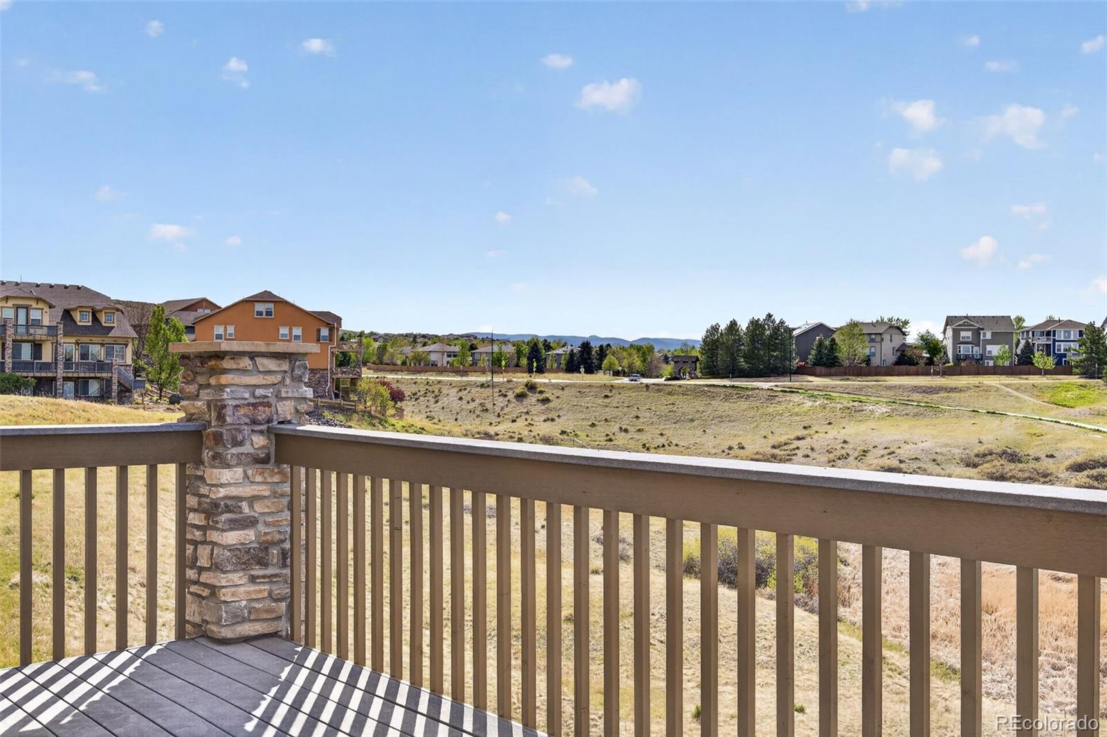 10872 Valleybrook Circle Highlands Ranch, CO 80130 - Photo 44 of 50 a view of city and mountain from a balcony