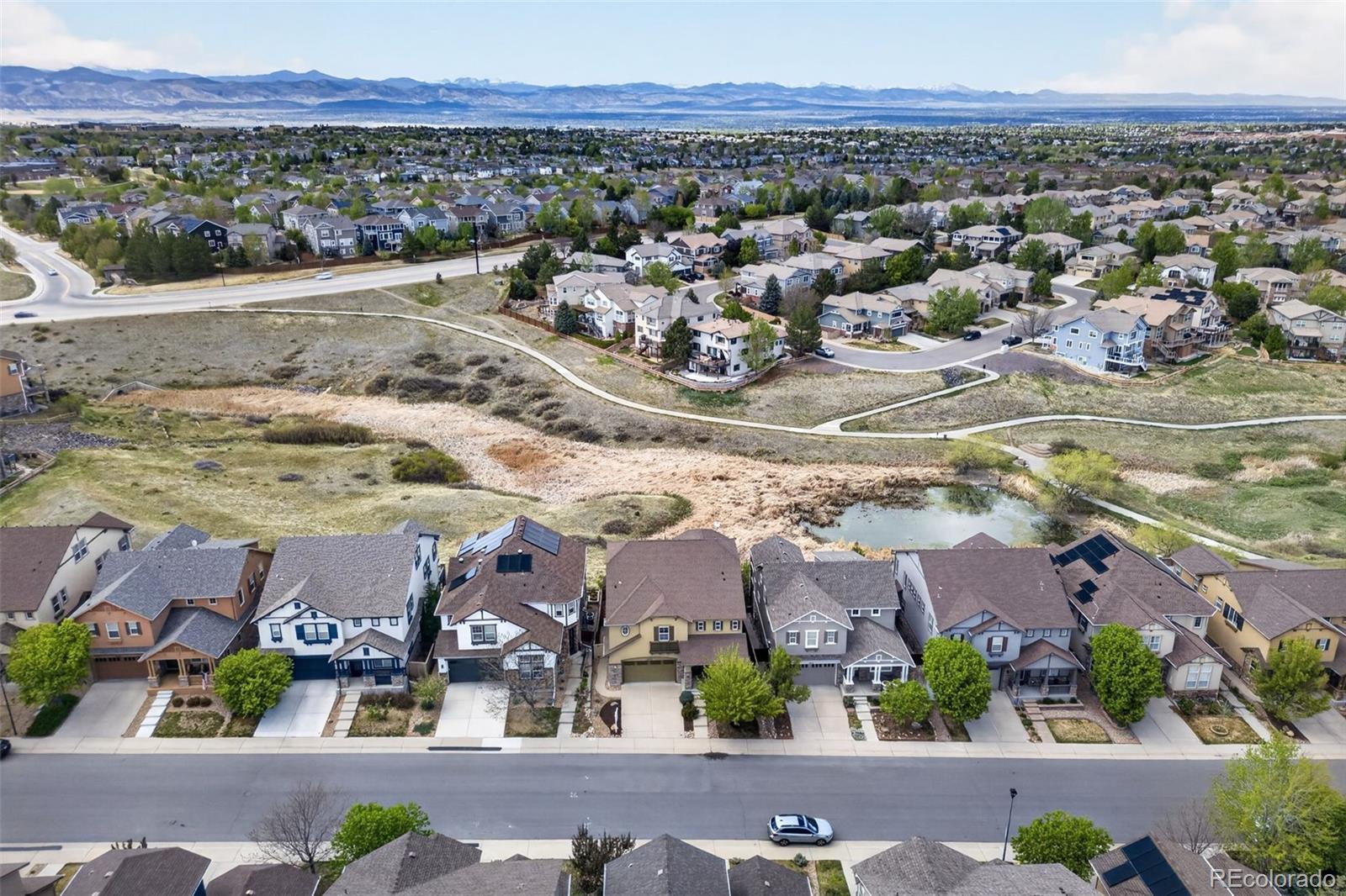 10872 Valleybrook Circle Highlands Ranch, CO 80130 - Photo 49 of 50 an aerial view of residential houses with outdoor space and ocean view
