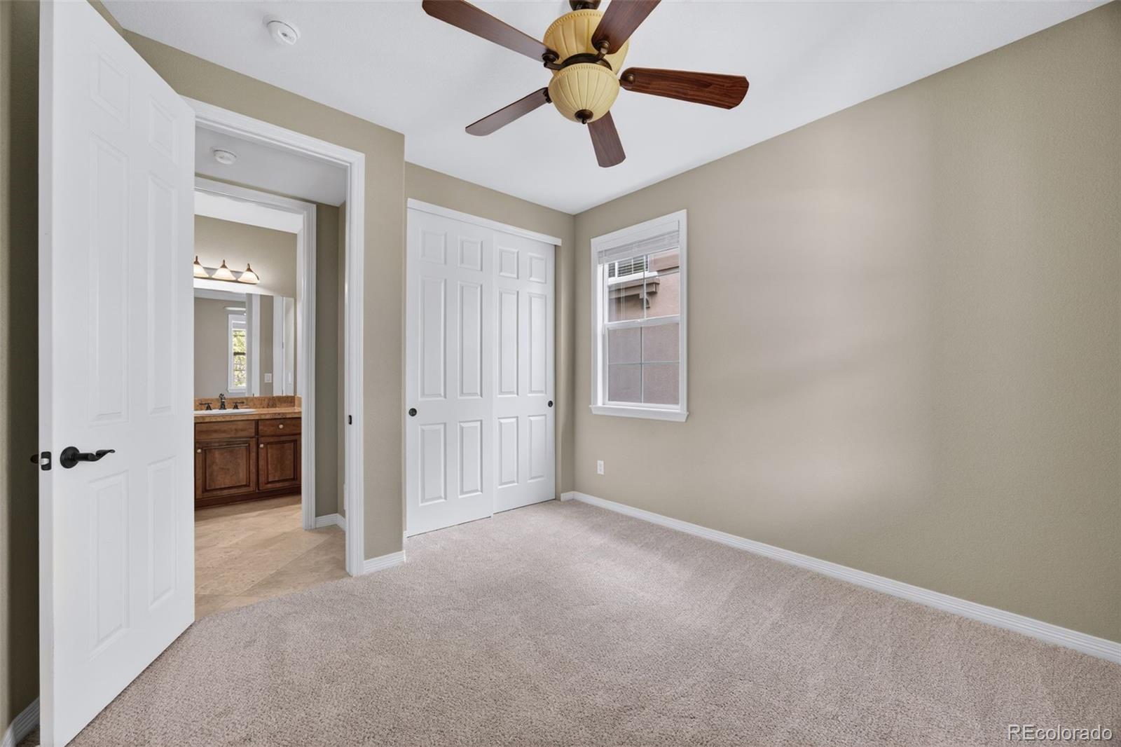 10872 Valleybrook Circle Highlands Ranch, CO 80130 - Photo 7 of 50 an empty room and chandelier fan