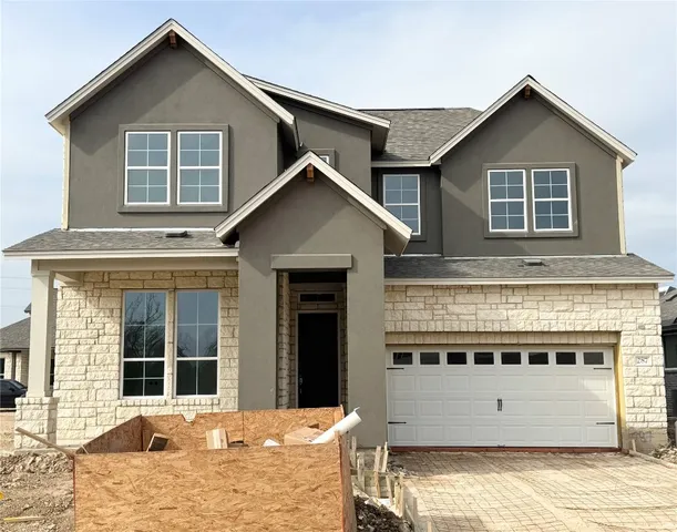 a view of a house with large windows