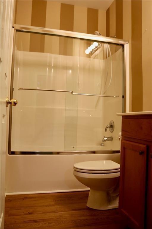 607 Hidden Close Woodstock, GA 30188 - Photo 7 of 11 a bathroom with a toilet and a shower