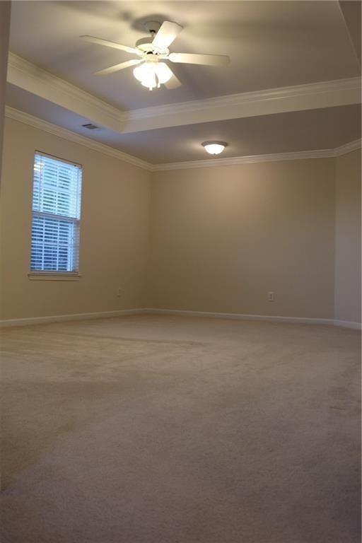 607 Hidden Close Woodstock, GA 30188 - Photo 9 of 11 en empty room with windows and ceiling fan