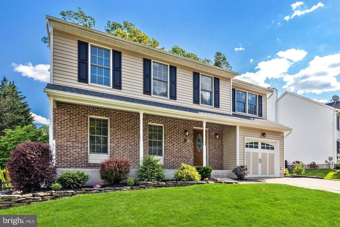 1038 Alexandria Way Bel Air, MD 21014 - Photo 1 of 1 front view of a brick house with a yard