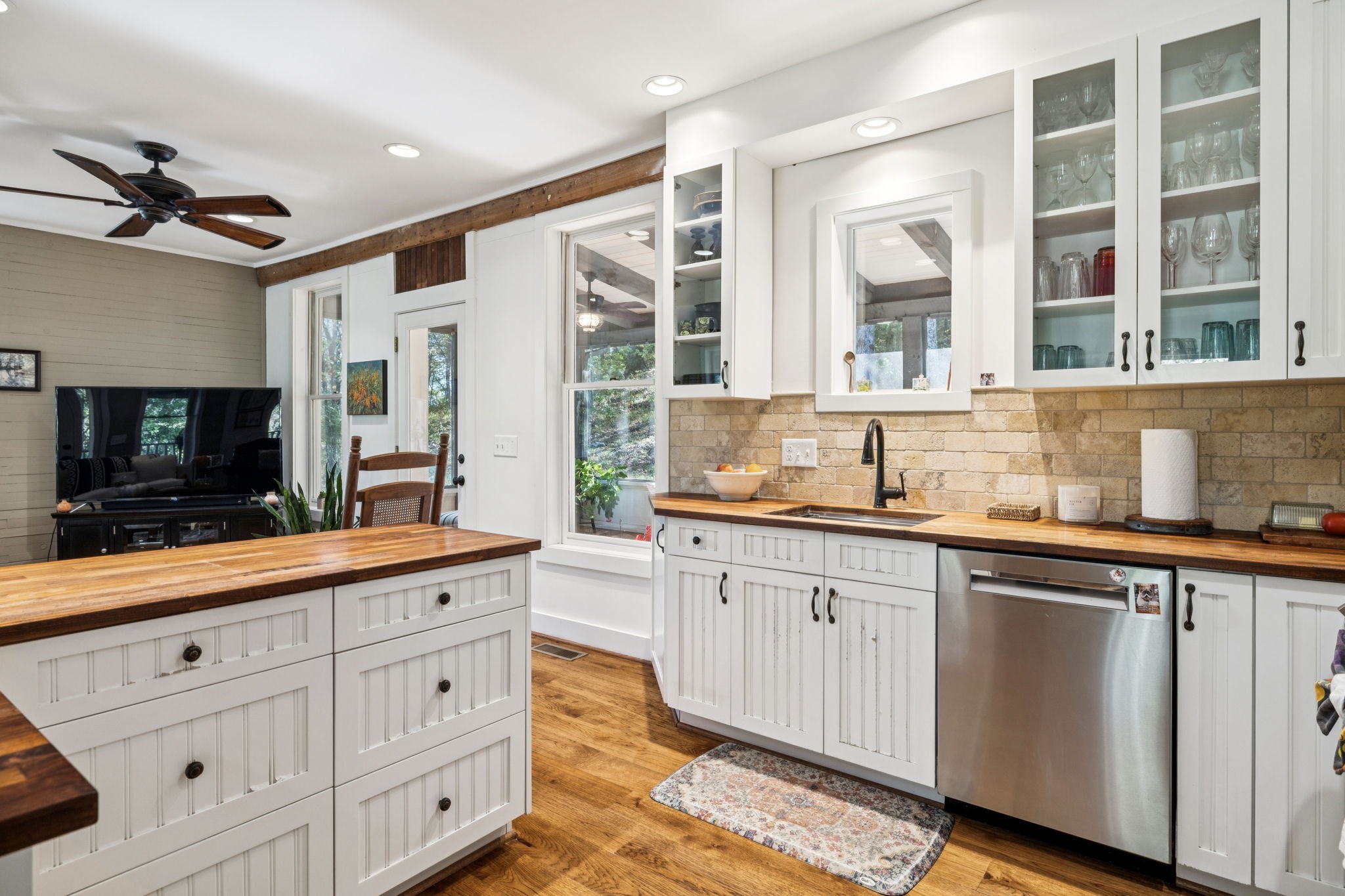 2064 Old Hillsboro Road Franklin, TN 37064 - Photo 27 of 57 a kitchen with granite countertop a sink and white cabinets