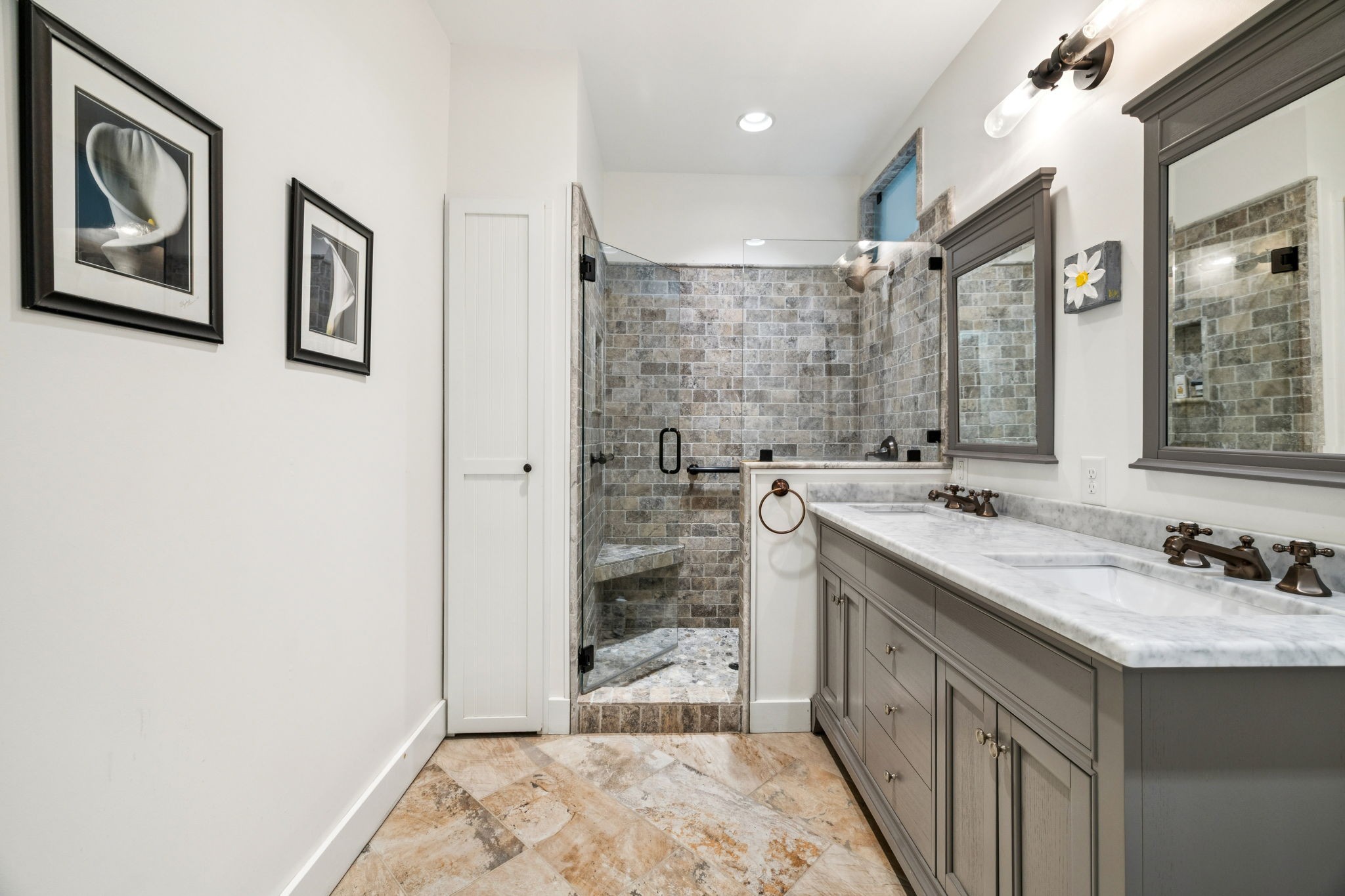 2064 Old Hillsboro Road Franklin, TN 37064 - Photo 36 of 57 a bathroom with a granite countertop sink a mirror a vanity and shower
