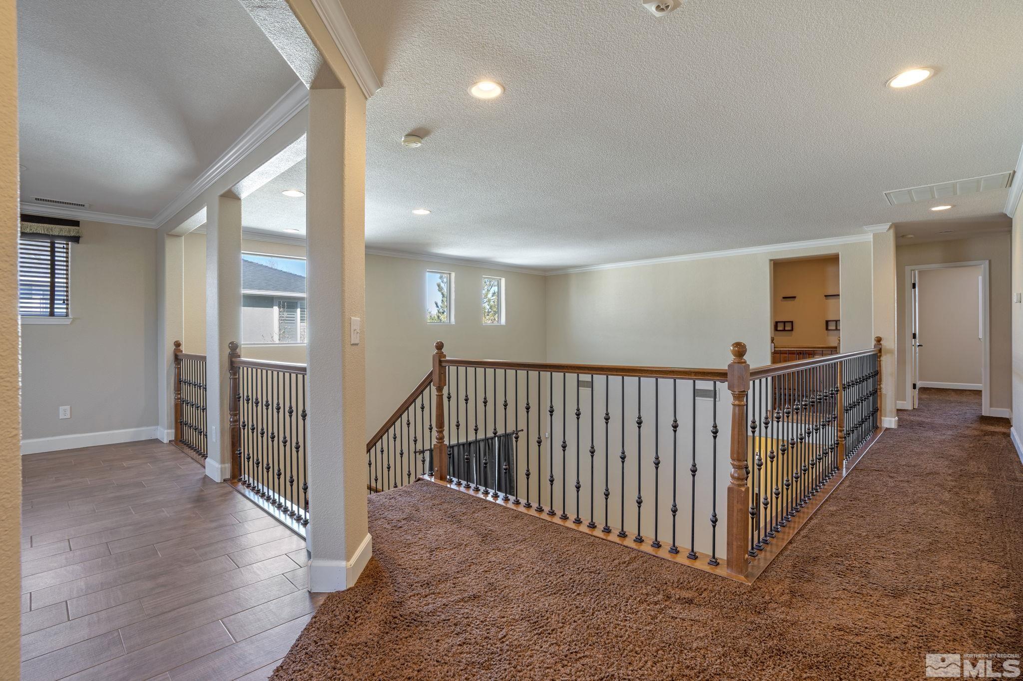 1980 Angel Ridge Drive Reno, NV 89521 - Photo 20 of 39 a view of a hallway with windows and stairs