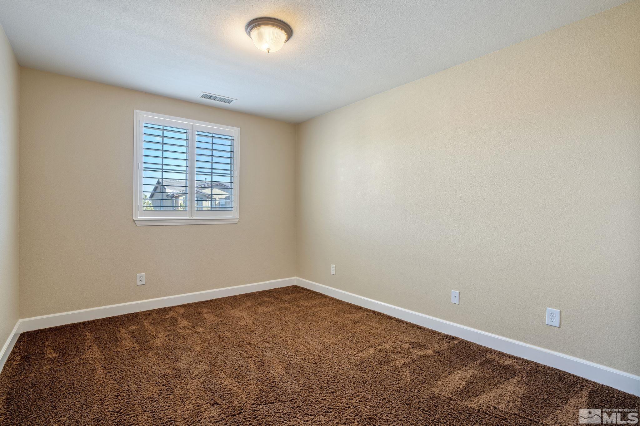 1980 Angel Ridge Drive Reno, NV 89521 - Photo 26 of 39 an empty room with a window