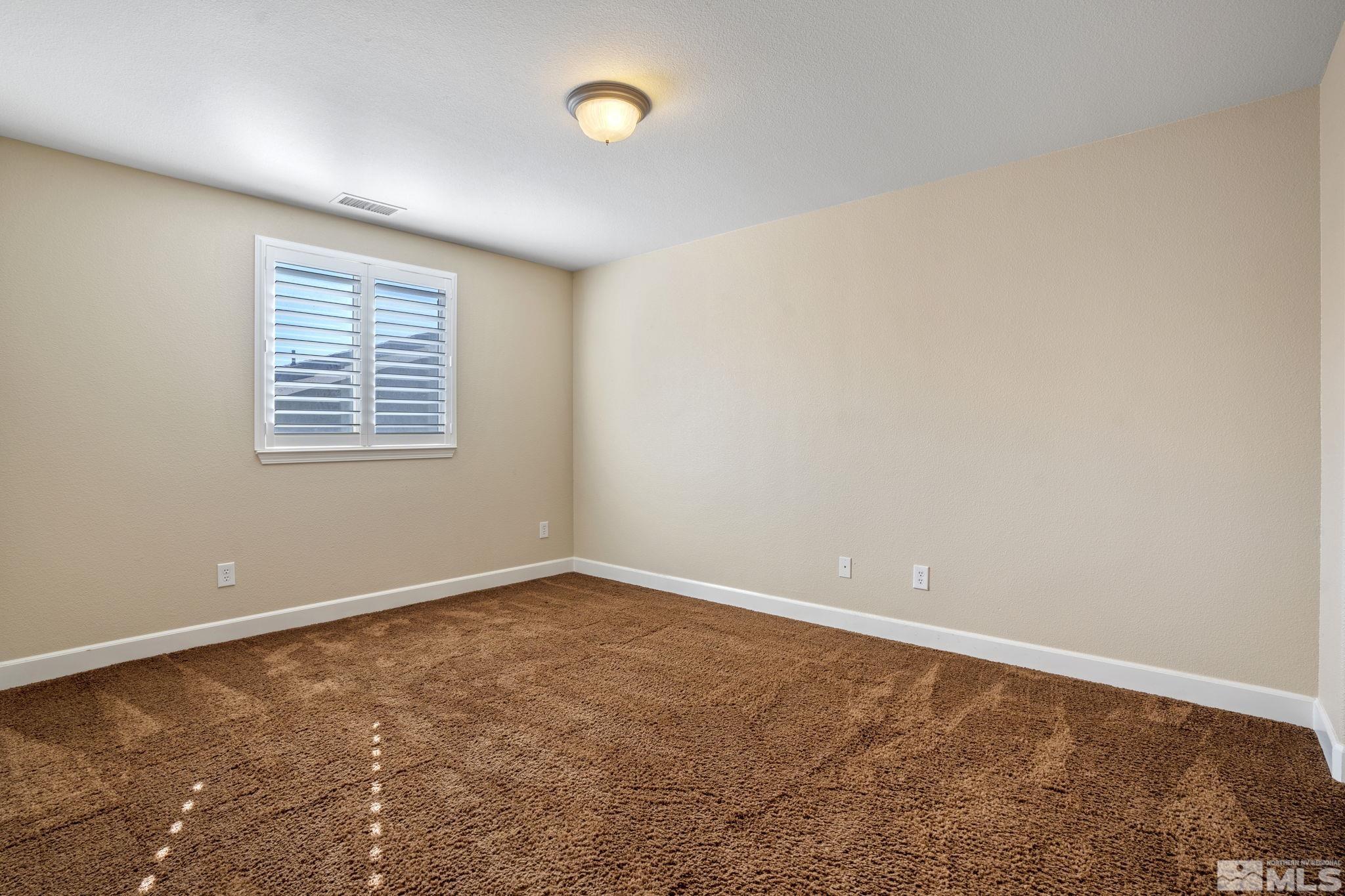 1980 Angel Ridge Drive Reno, NV 89521 - Photo 28 of 39 an empty room with a window