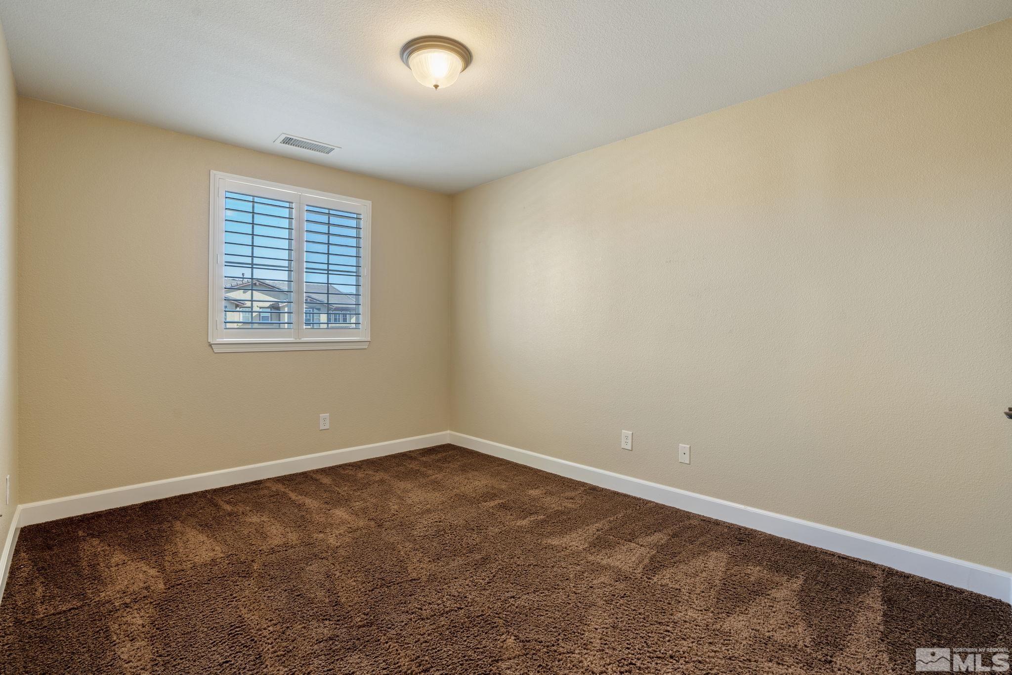 1980 Angel Ridge Drive Reno, NV 89521 - Photo 29 of 39 an empty room with a window