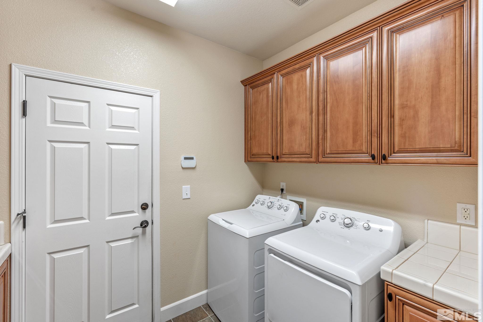 1980 Angel Ridge Drive Reno, NV 89521 - Photo 31 of 39 a view of storage and utility room with washer and dryer
