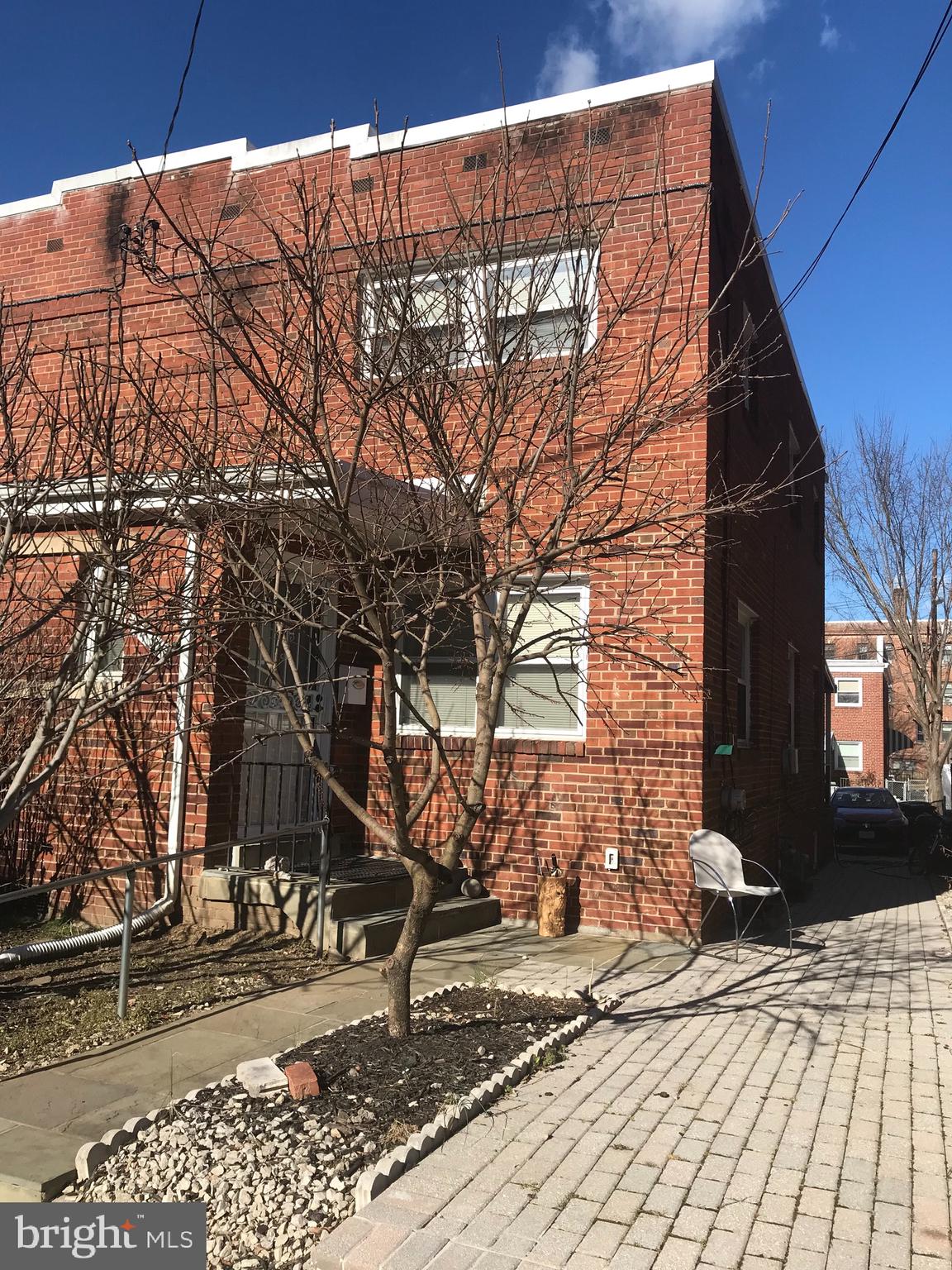 1437 Rittenhouse Street Northwest Washington, DC 20011 - Photo 1 of 16 Brick pavedFront yard with fruit trees