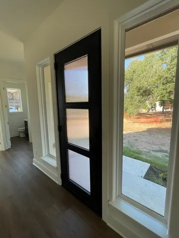 a view of a room that has a large window