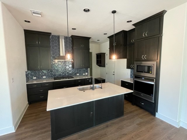 137 Limestone Drive Georgetown, TX 78628 - Photo 4 of 18 a kitchen with stainless steel appliances a sink stove and refrigerator